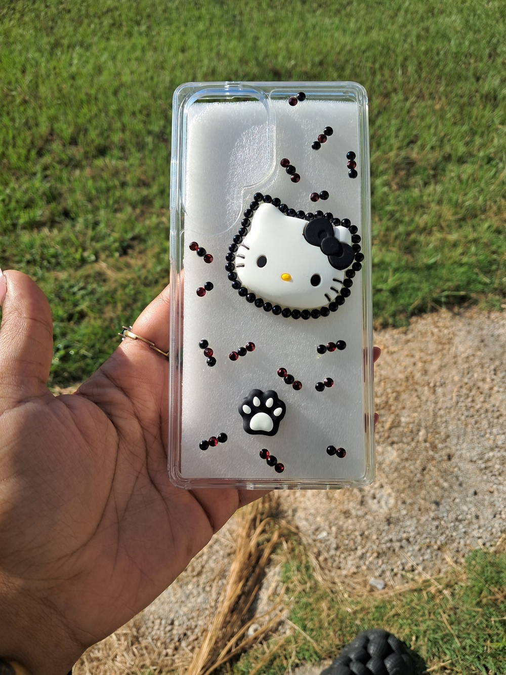 Hello Kitty Clear Phone Case with Black Accents and Paw Charm. S25 ULTRA